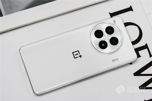 Close-up shot of a white OnePlus 13 smartphone resting on a table, showcasing its sleek design and features.